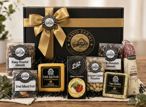 Farmers Favorite Box with honey roasted almonds, milk chocolate almonds, roasted and salted pistachios, dried mixed fruit, dry salami, Dutch-style gouda, sage cheddar and water crackers