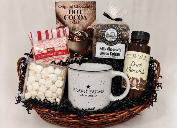Hot Cocoa Gift Basket with hot cocoa mix, dark chocolate sauce, marshmallows, milk chocolate jumbo raisins, peppermint divinity and a Bravo Farms campfire mug