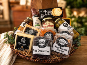 Charcuterie Basket with cutting board, salami, three cheeses, honey, olives, pepper jelly, dried apricots, cranberries and honey roasted almonds