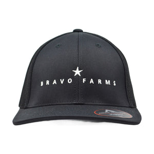 Black Flexfit cap with a white Bravo Farms star logo