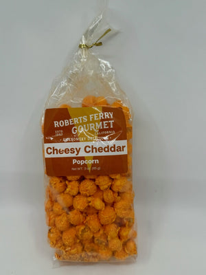 Robert's Ferry cheesy cheddar popcorn in a clear bag
